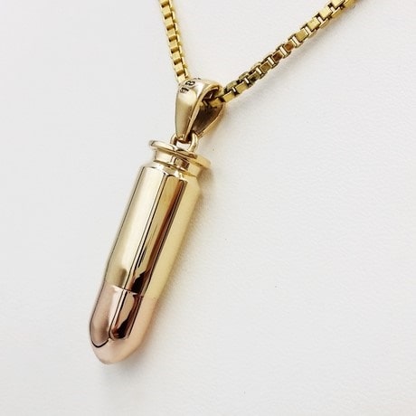 Bullet pendant in gold